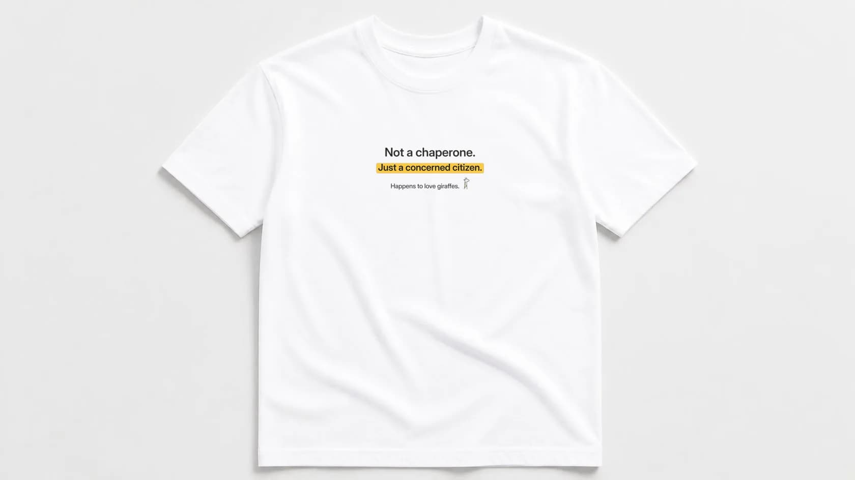 White unisex tee laid flat with "Not a chaperone. Just a concerned citizen. Happens to love giraffes." in charcoal with a sunny yellow highlight