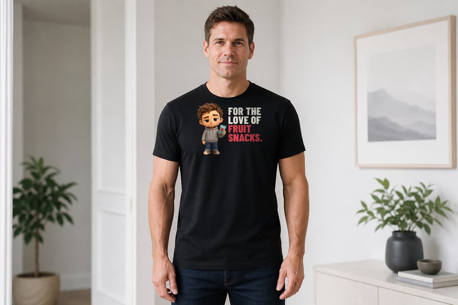 Man wearing a black For the Love of Fruit Snacks dad shirt with cream stacked lettering and a plush dad holding a fruit snacks pouch