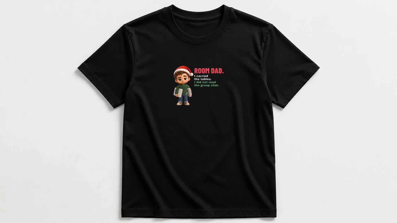 Black men's t-shirt flat-lay with a deadpan plush dad in a Santa hat carrying folding tables, next to red "ROOM DAD.", cream "I carried the tables." and green "I did not read the group chat."