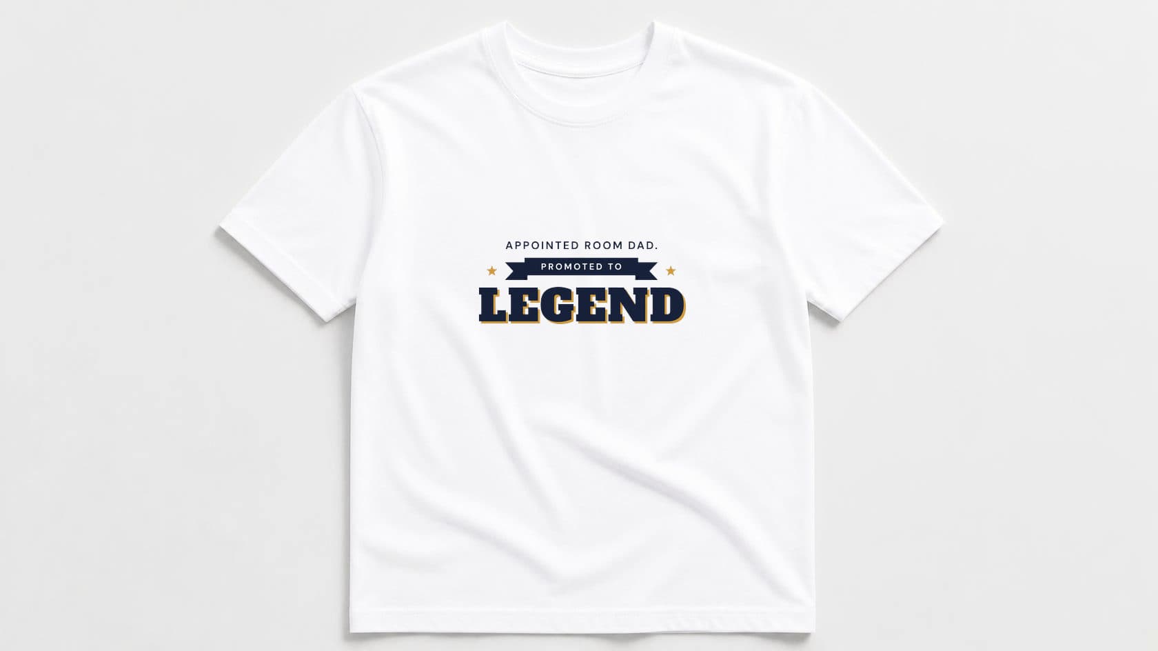 White crew tee printed with "Appointed Room Dad." in navy capitals, "Promoted to" on a navy ribbon and a big navy slab "LEGEND" with a gold shadow